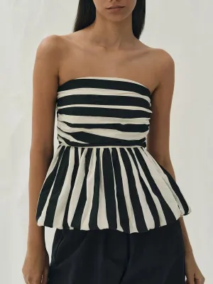 Monochrome Muse: A Strapless Beauty with Bold Stripes